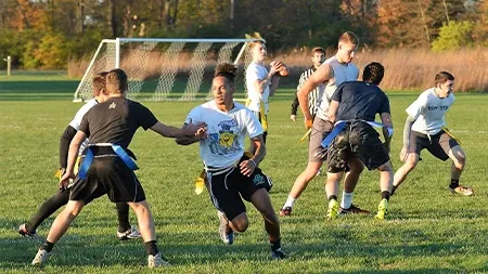 Students playing flag football